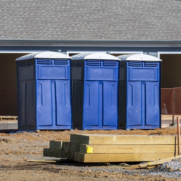 what is the cost difference between standard and deluxe portable toilet rentals in Manitou